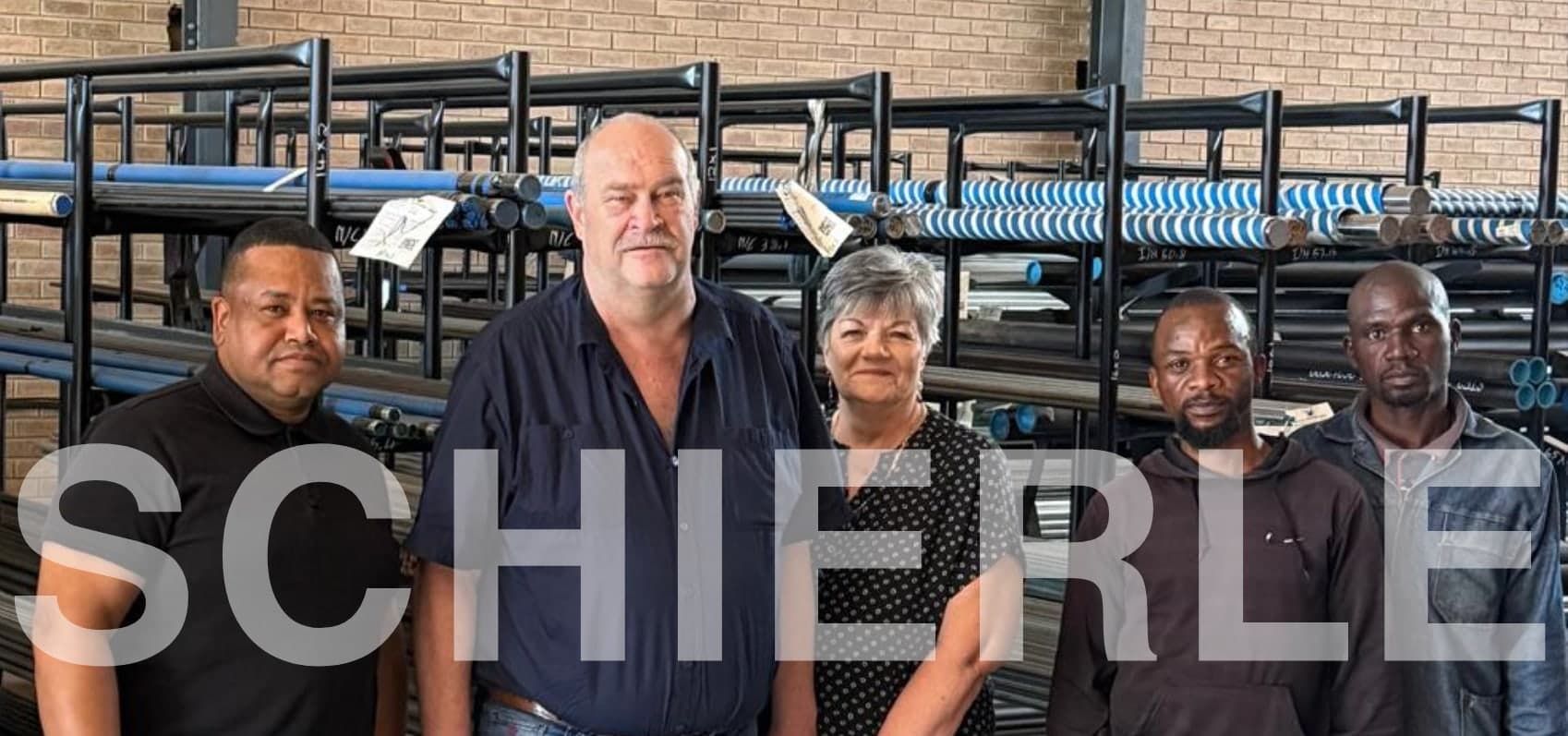 The Schierle South Africa team in front of the tube racking at our warehouse.